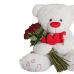Λούτρινος αρκούδος με μια αγκαλιά τριαντάφυλλα.