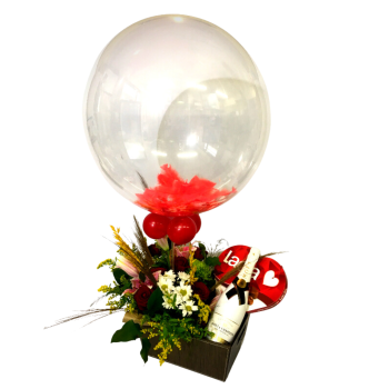 Moet Ice in a Lether Basket one Lacta with Flowers and Balloon.